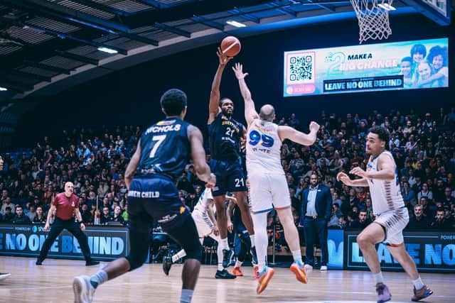 On target: Sheffield Sharks Marcus Delpeche (No 21) floats a two-pointer over the heads of the Cheshire Phoenix defence (Picture: Adam Bates)