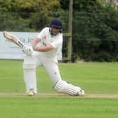 WAITING GAME: Woodlands' Tim Jackson drives through the covers but the league leaders were beaten by Townville and have to wait until the last weekend of the season for the points they need to win the Bradford Premier title. Picture: Steve Riding.