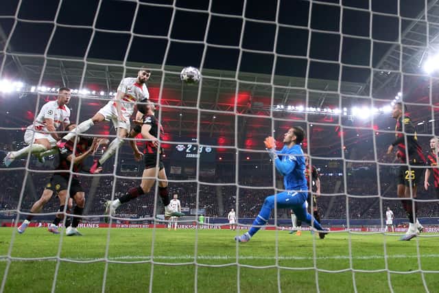 Tie in the balance: Leipzig's Croatian defender Josko Gvardiol (3rd L) gets up to score the equaliser in the first leg with Manchester City. (Picture: RONNY HARTMANN/AFP via Getty Images)