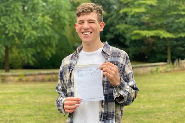 Bertie Wood holding up his A Level results. (Pic credit: Ripon Grammar School)