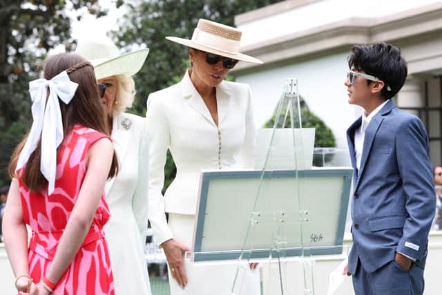 First Lady Melania Trump wears a pair of Ray-Ban Meta glasses during an event with Queen Camilla in the tennis pavilion of the White House. PIC: Suzanne Plunkett/PA Wire