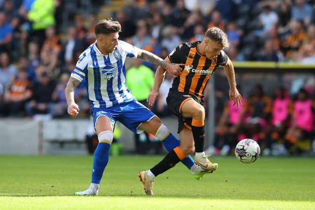 Back in August: Regan Slater of Hull City is challenged by Josh Windass of Sheffield Wednesday during the Sky Bet Championship match at the start of the season (Picture: Ashley Allen/Getty Images)
