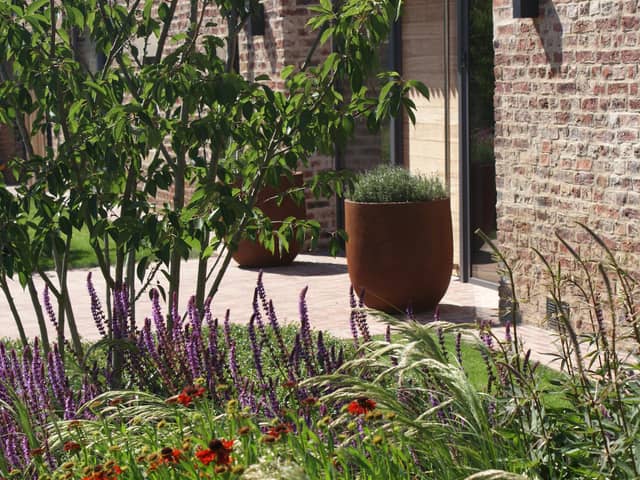 Pots and attractive planting near the door makes a good impression says garden designer Alistair Baldwin