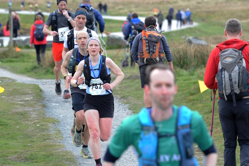 The Three Peaks Race. Runners are pictured running by Ribblehead Viaduct.Picture taken by Yorkshire Post Photographer Simon Hulme 27th April 2024