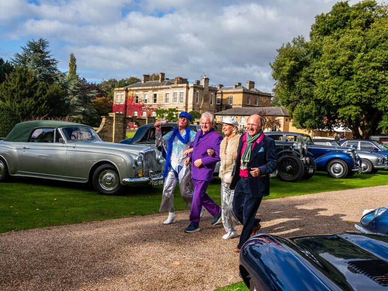 Pictured Liz and Michael Bell, with Belinda and Christopher Fordy dressed as ABBA band members walk through the line up of classic cars whist at Bowcliffe Hall near Bramham.