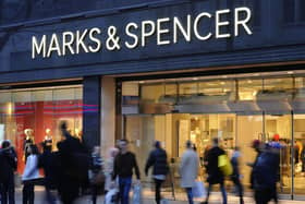Marks & Spencer has revealed a jump in sales in the face of pressure on customer finances but saw profits dip over the past year on the back of higher costs.