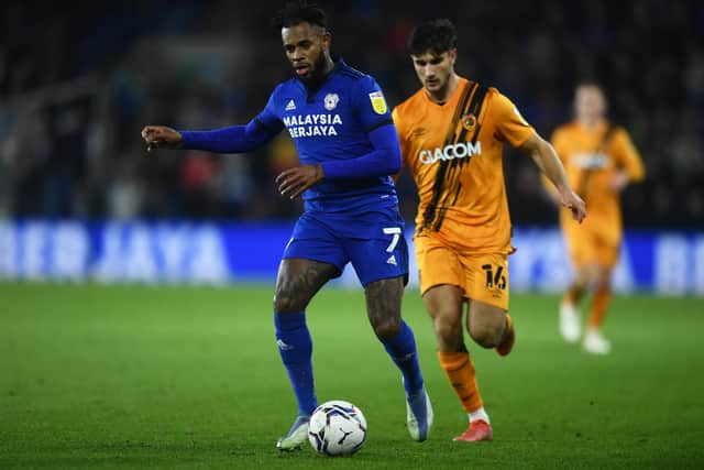 CARDIFF, WALES - NOVEMBER 24: Leandro Bacuna of Cardiff City is tackled by Ryan Longman of Hull City during the Sky Bet Championship match between Cardiff City and Hull City at the Cardiff City Stadium on November 24, 2021 in Cardiff, Wales. (Photo by Harry Trump/Getty Images)