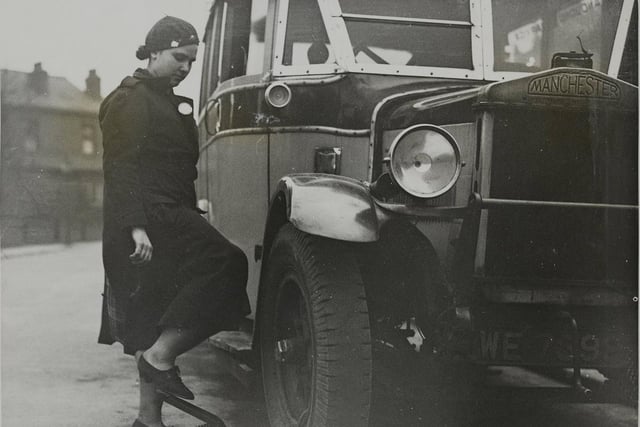 One of 12 women of Britain who were licensed to drive motor service vehicles, Mrs H. A. Hudson of St. Michael 's-lane, Hadingly, Leeds, who drove a bus. One thing she wouldn't do was wear masculine clothes on the job.