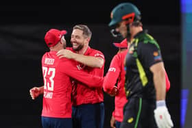 England's Chris Woakes (C) celebrates with team-mates after dismissing Australias Mitchell Marsh during the third and final match of the T20 series in Canberra. Picture: DAVID GRAY/AFP via Getty Images