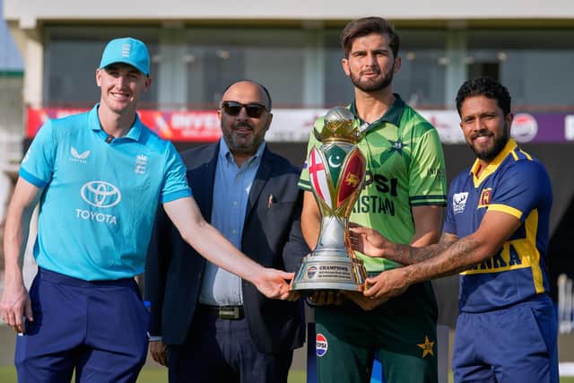 England's captain Harry Brook, left, Pakistan's captain Shaheen Shah Afridi, second right, Sri Lanka's captain Kusal Mendis, right, and a representative of main sponsor pose for photograph with Tri-Nation one-day international series, in Rawalpindi, Pakistan. (AP Photo/Anjum Naveed)