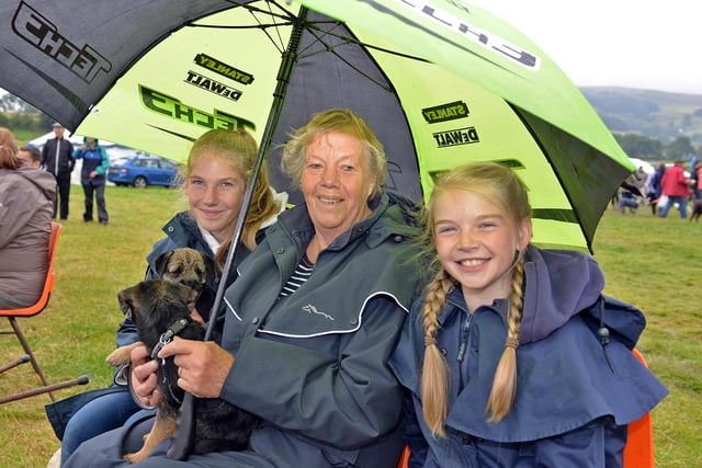 Enjoying Hope Show in 2015 despite the weather were Lauren, 13, Amelia, 10 with their Nana and puppies Flo and Tommy