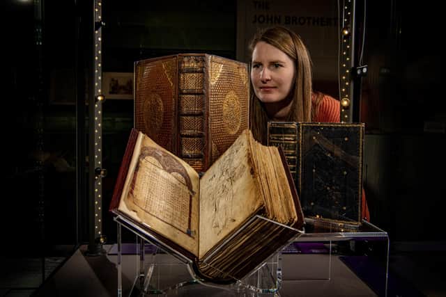 Rosie Shepley, Senior Conservation Technician at University of Leeds Libraries looks at exhibits in the Books and Benefactors exhibition, photographed for The Yorkshire Post by Tony Johnson.  Running at the University of Leeds' Treasures of the Brotherton Gallery until 6 April 2024, the exhibition celebrates the arrival of a group of rare and beautiful books dating back to the 10th century that were allocated to the University via the UK Acceptance in Lieu scheme.
