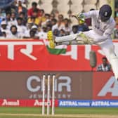 CATCH IT: England's wicketkeeper Ben Foakes jumps to collect a throw on the third day in Visakhapatnam Picture: AP/Manish Swarup
