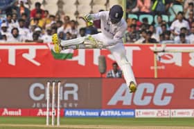 CATCH IT: England's wicketkeeper Ben Foakes jumps to collect a throw on the third day in Visakhapatnam Picture: AP/Manish Swarup