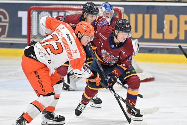 BATTLE STATIONS: Sheffield Steelers' Ivan Bjorkly Nordstrom (left) prepares for a face-off against Guildford's Josh Waller. Picture: John Uwins/EIHL Media.