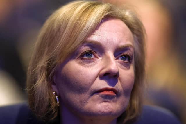 BIRMINGHAM, ENGLAND - OCTOBER 03: British Prime Minister Liz Truss watches Chancellor of the Exchequer Kwasi Kwarteng (not pictured) deliver a speech on day two of the annual Conservative Party conference on October 3, 2022 in Birmingham, England. This year the Conservative Party Conference will be looking at "Getting Britain Moving" with more jobs and higher salaries. (Photo by Jeff J Mitchell/Getty Images)
