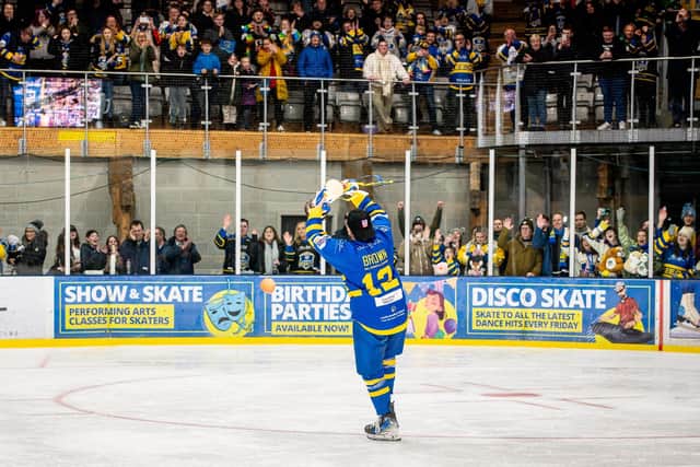 CHAMPION MOMENT: Kieran brown celebrates with fans after being presented with the NIHL National league trophy. Picture: Ben Gordon/Knights Media.