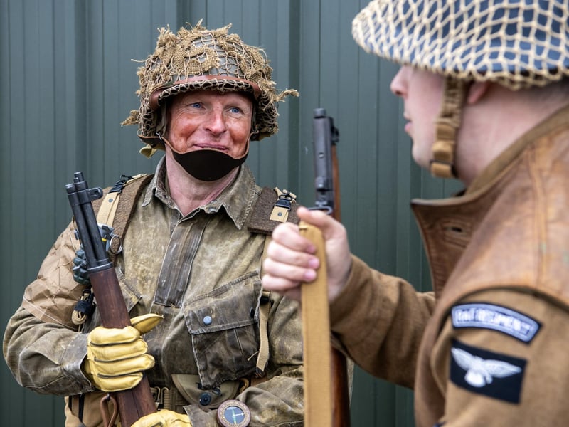 Re-enactors in character and costume.