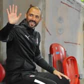 Waving goodbye: Wayne Carlisle was called back into the Rotherham United dugout as the new manager waits in the wings. (Picture: Rotherham Advertiser)