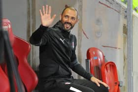 Waving goodbye: Wayne Carlisle was called back into the Rotherham United dugout as the new manager waits in the wings. (Picture: Rotherham Advertiser)