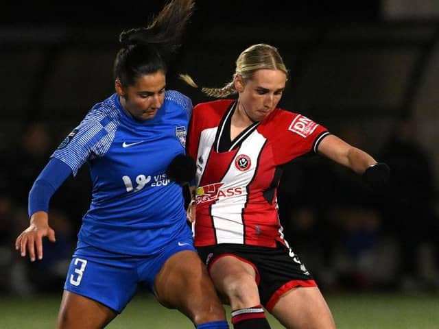 Eye on the ball: Sheffield United midfielder Bex Rayner, right, playing against Durham in the FA Women's Continental Tyres League Cup earlier this season. Tonight she makes her 100th appearance for the club. (Picture: Stu Forster/Getty Images)