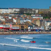 Surfers take to water on the South Bay of Scarborough.