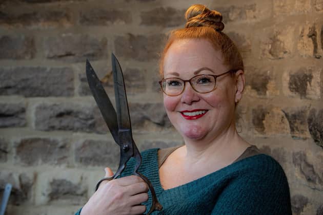 Cutler Grace Horne with tailor's shears in her tiny workshop in Sheffield.
Photographed by Tony Johnson for The Yorkshire Post.