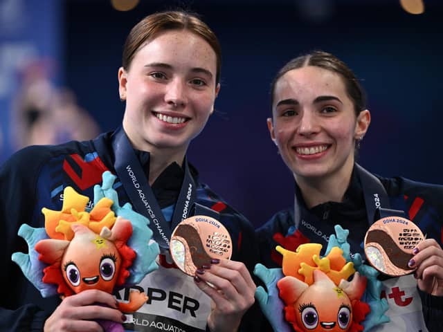Britain's bronze-medallists Scarlett Mew Jensen and Yasmin Harper of City of Sheffield pose with their medals after the final of the women's 3m springboard synchro diving event during the 2024 World Aquatics Championships at Hamad Aquatics Centre in Doha on February 7, 2024. (Picture: SEBASTIEN BOZON/AFP via Getty Images)
