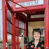 Artists Caitlin Mawhinney and Charlotte Murray in one of the phone boxes