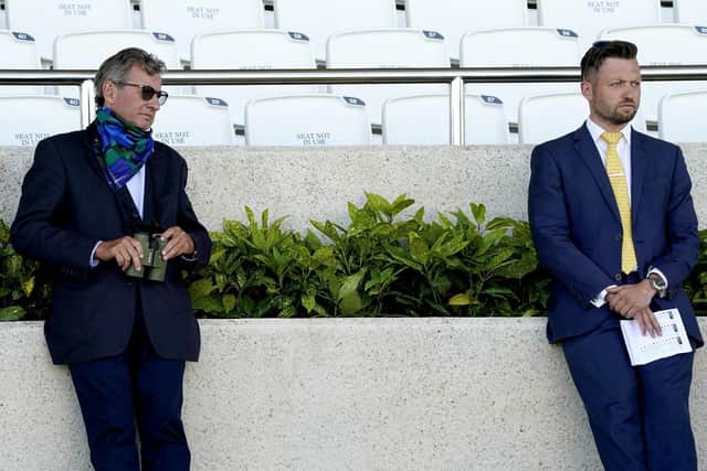OVER TO YOU - ALMOST: Mark Johnston (left) the trainer of more winners in the history of British racing than anyone else, is relinquishing his role as joint-trainer with his son, Charlie (right) although he is keen to stress he is not retiring. Picture: Alan Crowhurst/PA