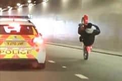 The motorcyclist performed a wheelie next to the police car on the A58.