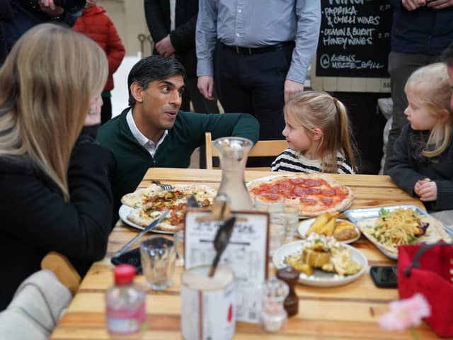 Prime Minister Rishi Sunak meets members of the public during a visit to the Altrincham Food Market in Greater Manchester.
