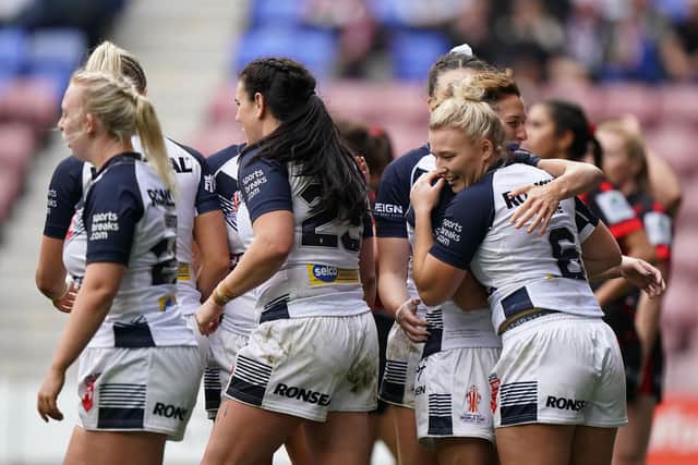 Georgia Roche, right, celebrates with team-mates after scoring England's sixth try. (Picture: Tim Goode/PA Wire)