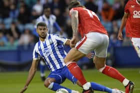 Sheffield Wednesday striker Ashley Fletcher sees his path blocked by former Owls defender and Mansfield Town captain Aden Flint. Picture: Steve Ellis.