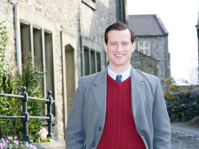 James Herriot (Nicholas Ralph) stands in Grassington, which stands in for Darrowby in All Creatures Great and Small. Picture: Helen Williams / Playground /Channel 5