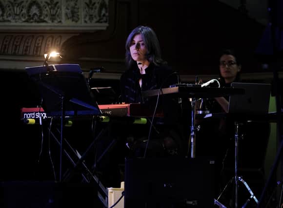 Julia Holter with her band and the Chorus of Opera North under conductor Hugh Brunt performing her live score for The Passion of Joan of Arc, at Huddersfield Town Hall for hcmf//. Picture: Brian Slater