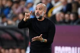 BACK TROUBLE: Manchester City manager Pep Guardiola