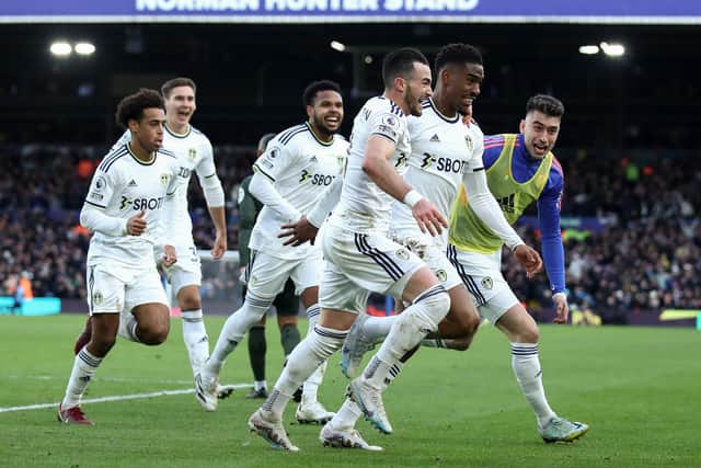 LEEDS, ENGLAND - FEBRUARY 25: Junior Firpo of Leeds United celebrates with team mates after scoring their sides first goal during the Premier League match between Leeds United and Southampton FC at Elland Road on February 25, 2023 in Leeds, England. (Photo by George Wood/Getty Images)