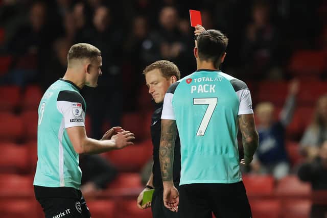 LONDON, ENGLAND - OCTOBER 17: Marlon Pack of Portsmouth is shown a red card by the Match Referee during the Sky Bet League One match between Charlton Athletic and Portsmouth at The Valley on October 17, 2022 in London, England. (Photo by Alex Pantling/Getty Images)