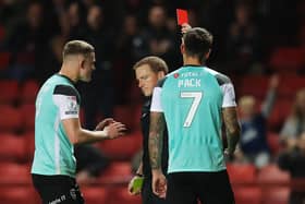 LONDON, ENGLAND - OCTOBER 17: Marlon Pack of Portsmouth is shown a red card by the Match Referee during the Sky Bet League One match between Charlton Athletic and Portsmouth at The Valley on October 17, 2022 in London, England. (Photo by Alex Pantling/Getty Images)