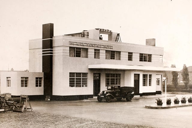 The Kirk Sandall Hotel, a glass hotel in Kirk Sandall, Yorkshire, shortly before completion, 1st October 1934. With a frontage to the main road, all the exterior and the handsome verandah which surmounts the main entrance are entirely built of glass. This is of heavy plate and attached to a cement foundation. The scheme is carried out in three colours, and the interior of all rooms on the ground floor is made of glass. Chairs, tables and electric light fittings will be chromium plated.   (Photo by Fox Photos/Hulton Archive/Getty Images)