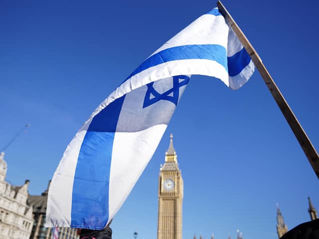 An Israeli flag at a vigil at Parliament Square in London. PIC: James Manning/PA Wire