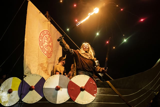 A firework display during the Flamborough Fire Festival, a Viking themed parade in aid of charities and local community groups, held on New Year's Eve in Flamborough near Bridlington, Yorkshire. Picture date: Saturday December 31, 2022.