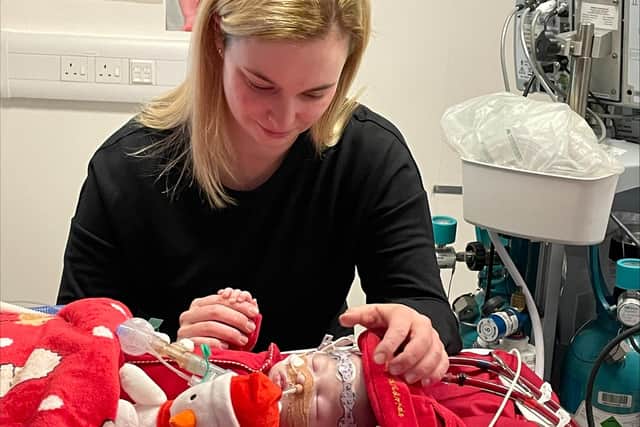 Emma Wathey, 27 with her baby George, who is in need of a new heart