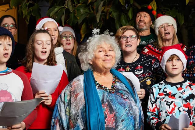 Undated Handout Photo from Miriam's Dickensian Christmas. Pictured: Miriam Margolyes in South West London with a group of Christmas carollers.
