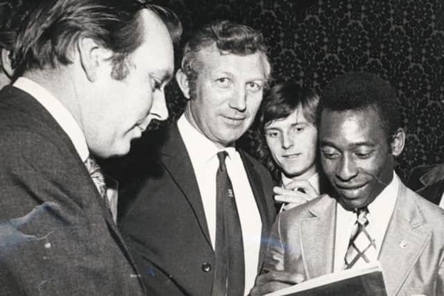 Pele signing an autograph for Tony Pritchett after the 1972 match