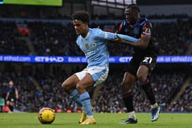 Manchester City's Norwegian midfielder #52 Oscar Bobb (L) vies with Huddersfield Town's English striker #21 Alex Matos (R) during the English FA Cup third round (Picture: Paul Ellis/AFP/Getty Images)