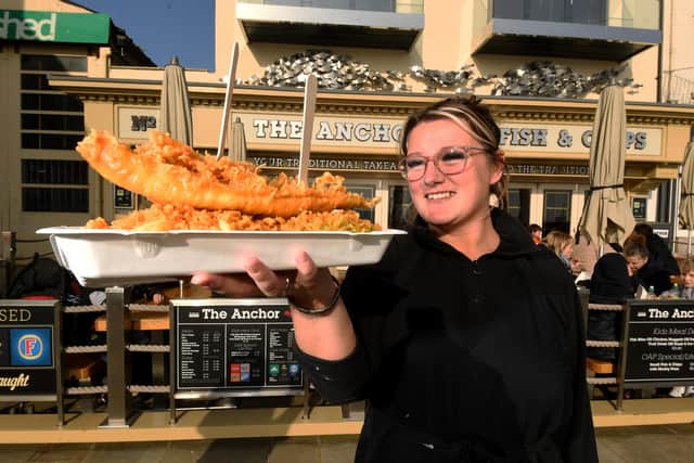 Jasmine James pictured with Fish and Chips outside the Anchor Fish Restaurant. Picture by Simon Hulme 15th February2023