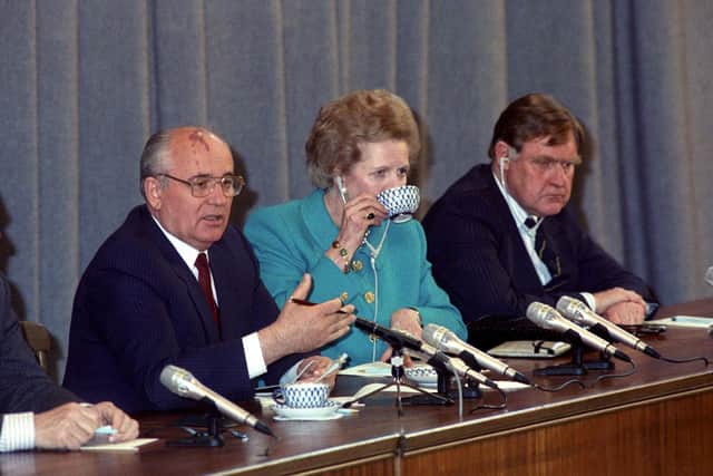 Prime Minister Margaret Thatcher at a press conference with Soviet President Mikhail Gorbachev, during her four-day visit to the USSR. Left to right are: Mikhail Gorbachev, Margaret Thatcher, and Thatcher's Press Secretary Bernard Ingham.
