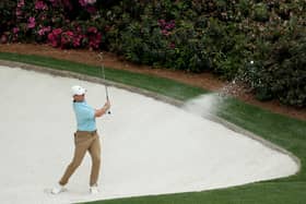 Rory McIlroy of Northern Ireland plays a shot from an impossibly white bunker on the 12th hole during the first round of the 2023 Masters Tournament at Augusta National Golf Club (Picture: Patrick Smith/Getty Images)